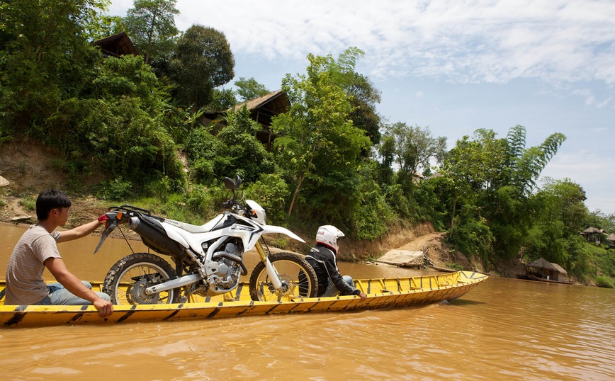 Motorbike Laos on a boat